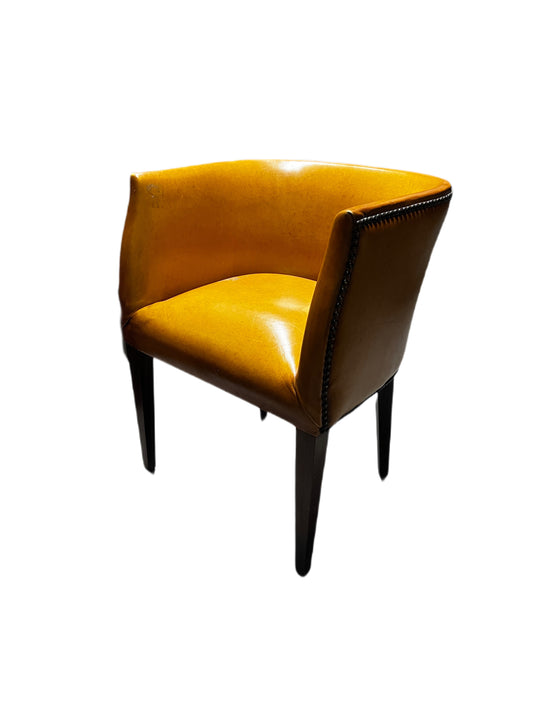 YELLOW ORANGE LEATHER CLUB CHAIR WITH RIVETS