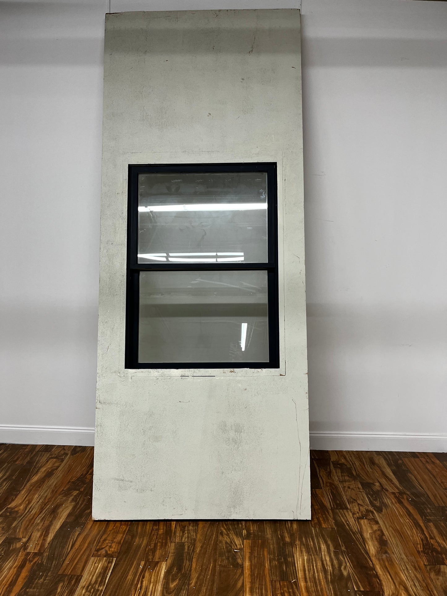 TEXTURED WALL WITH BLACK WINDOW