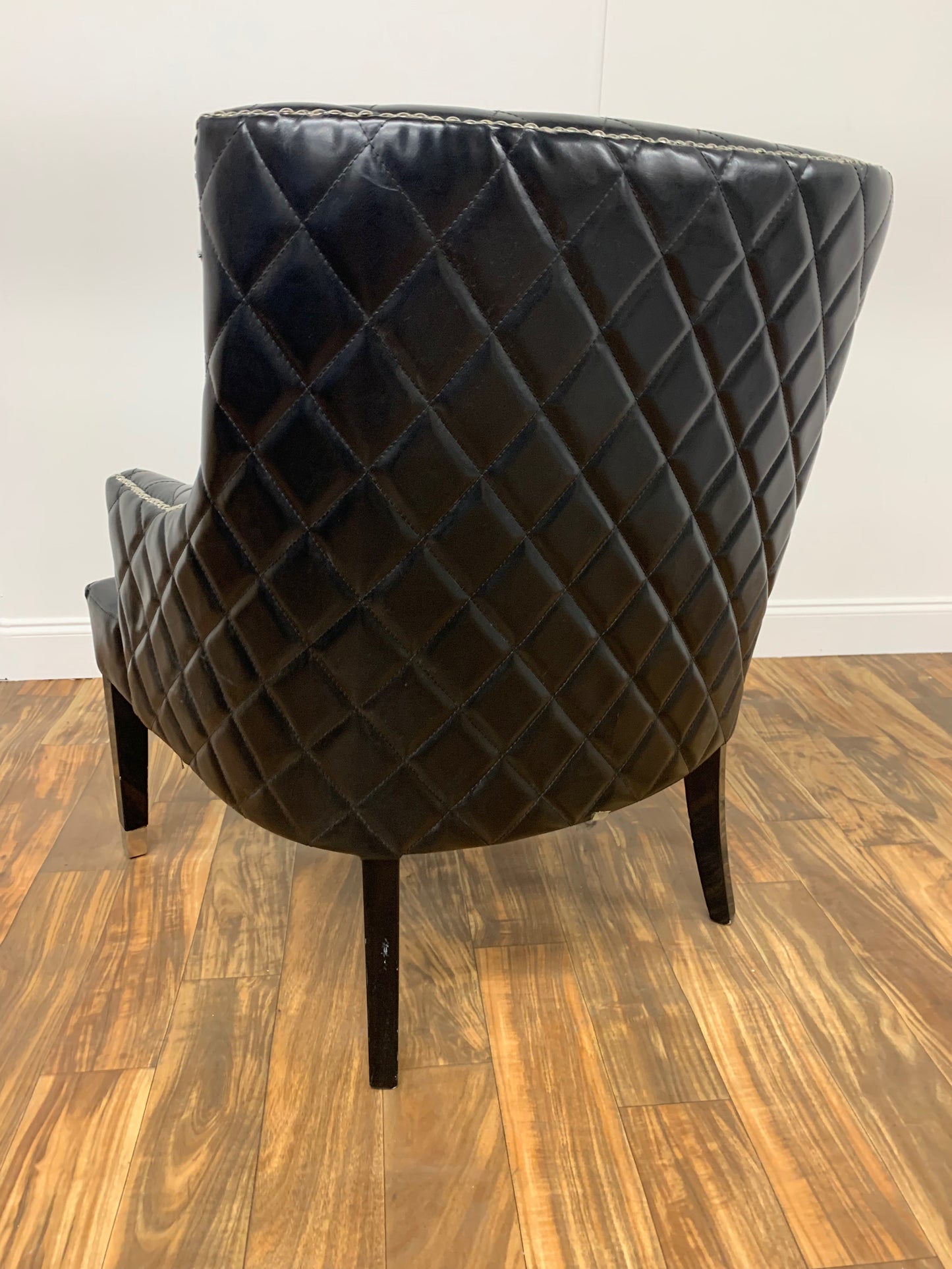 TUFTED BLACK LEATHER WINGBACK CHAIR WITH SILVER RIVETS