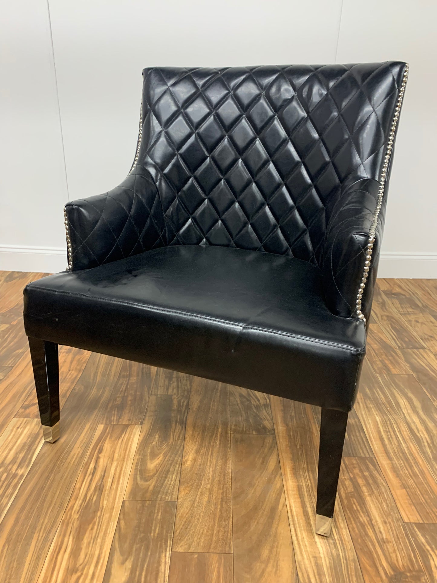 TUFTED BLACK LEATHER WINGBACK CHAIR WITH SILVER RIVETS