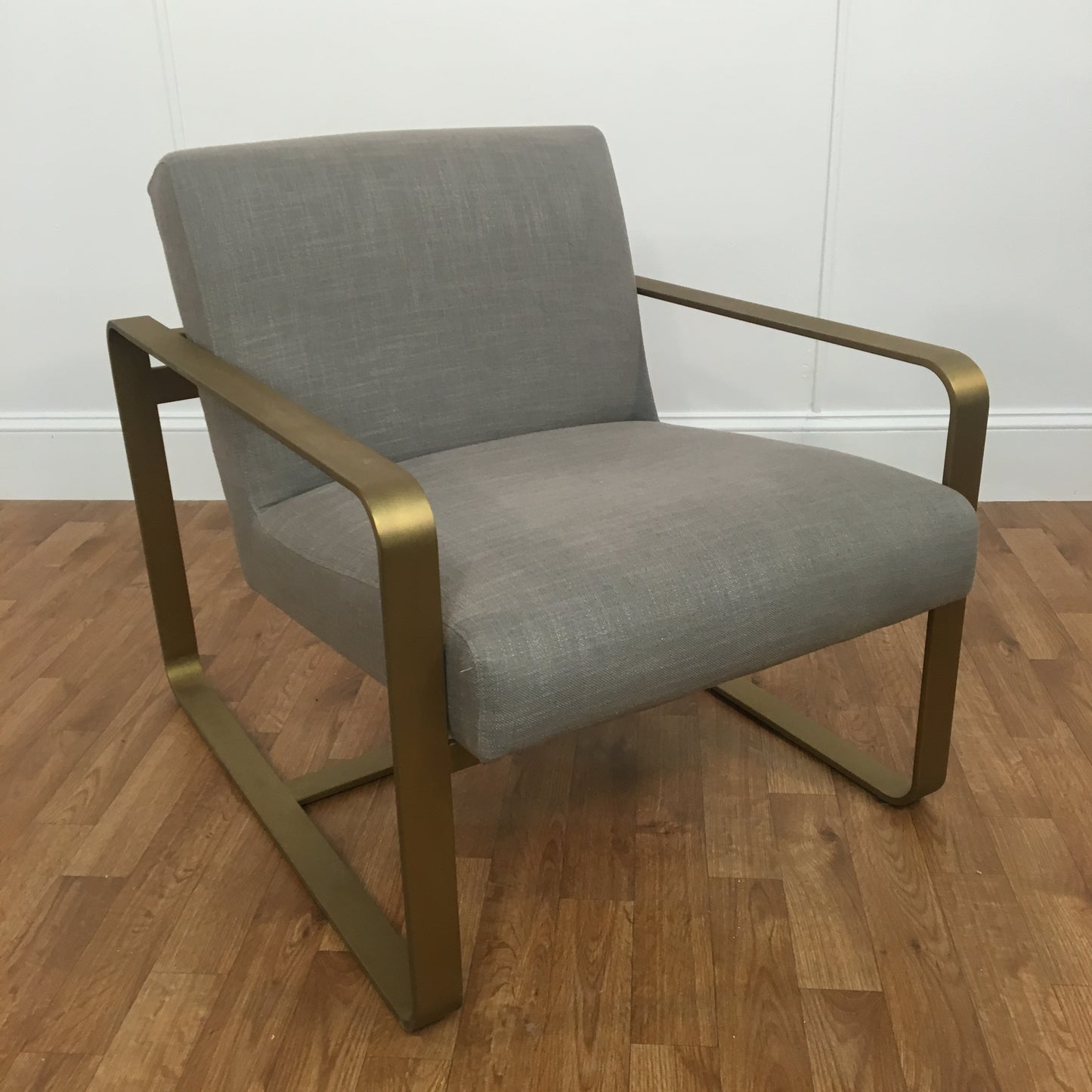 GRAY LINEN AND BRUSH GOLD ARM CHAIR WITH OTTOMAN