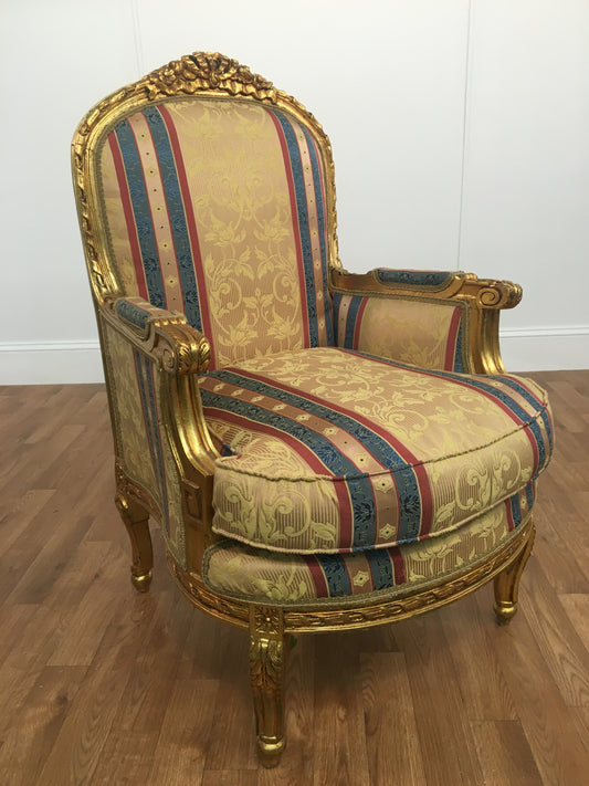 RED, GOLD  AND BLUE STRIPED ORNATE ARM CHAIR