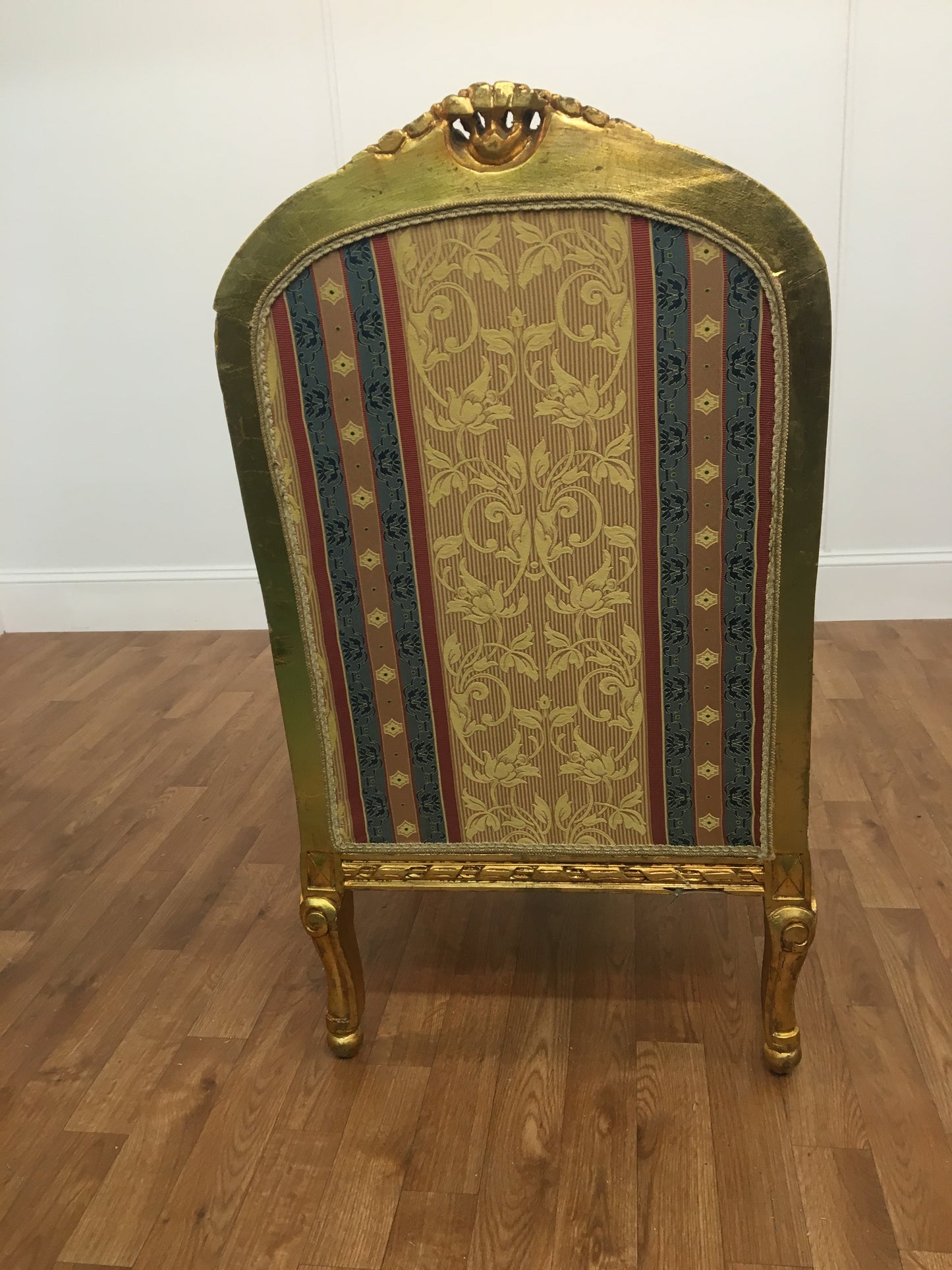 RED, GOLD  AND BLUE STRIPED ORNATE ARM CHAIR