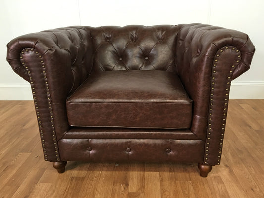 BROWN LEATHER ARM CHAIR WITH RIVETS